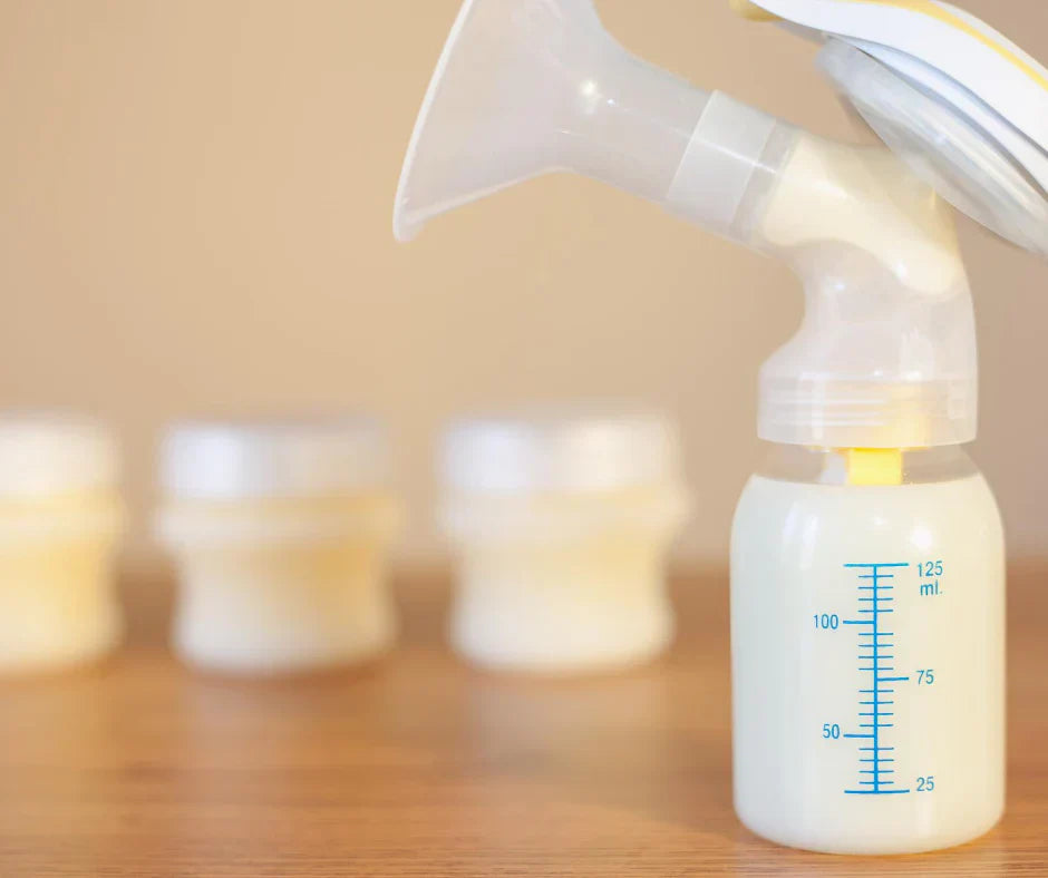 Breast pump collecting milk into storage bottle to support milk supply and lactation