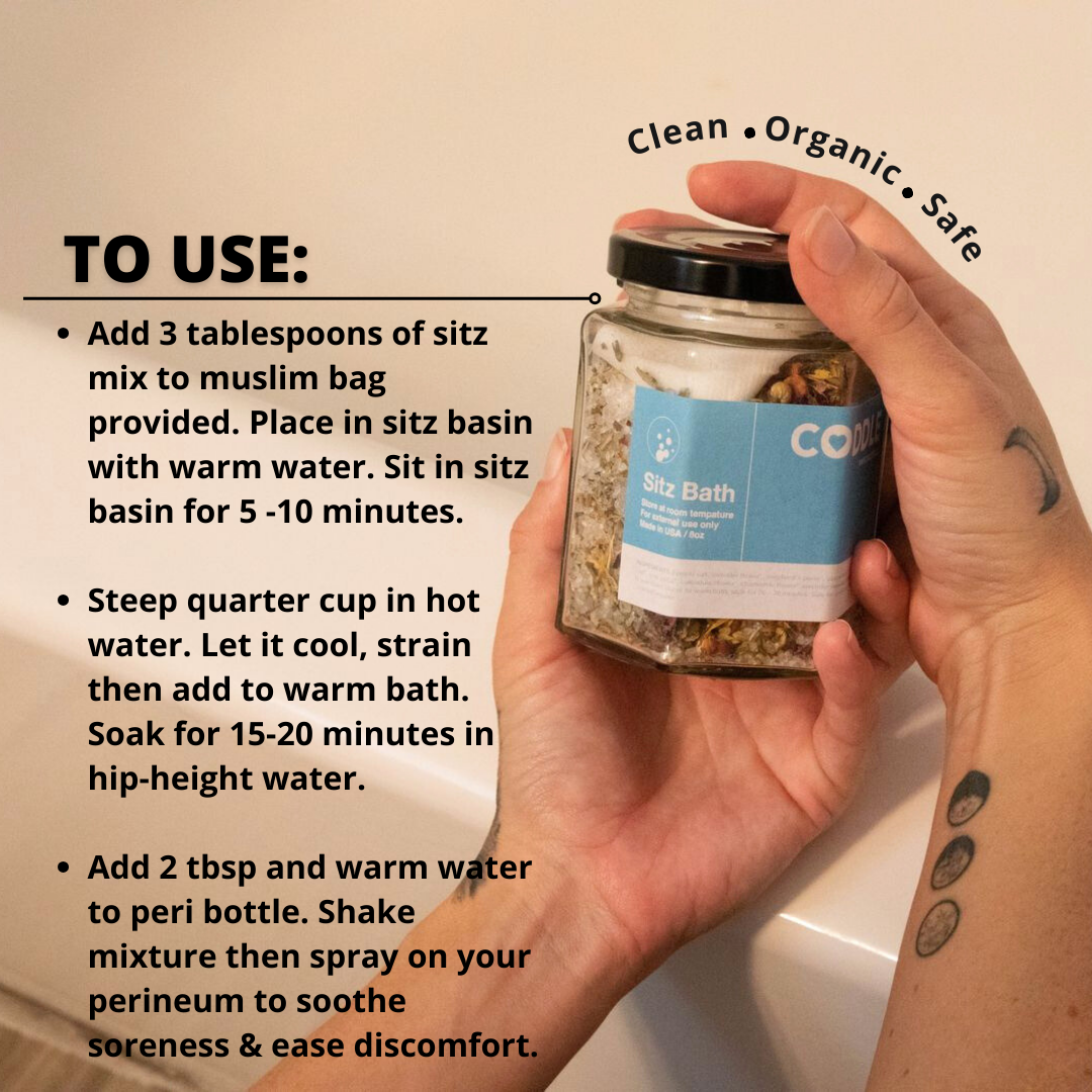 Hand holding a jar of CODDLE sitz bath mix with usage instructions on a bathroom background