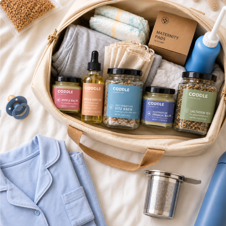 Packing postpartum recovery essentials including peri bottle, herbal sitz bath, massage oil and balms into hospital bag.