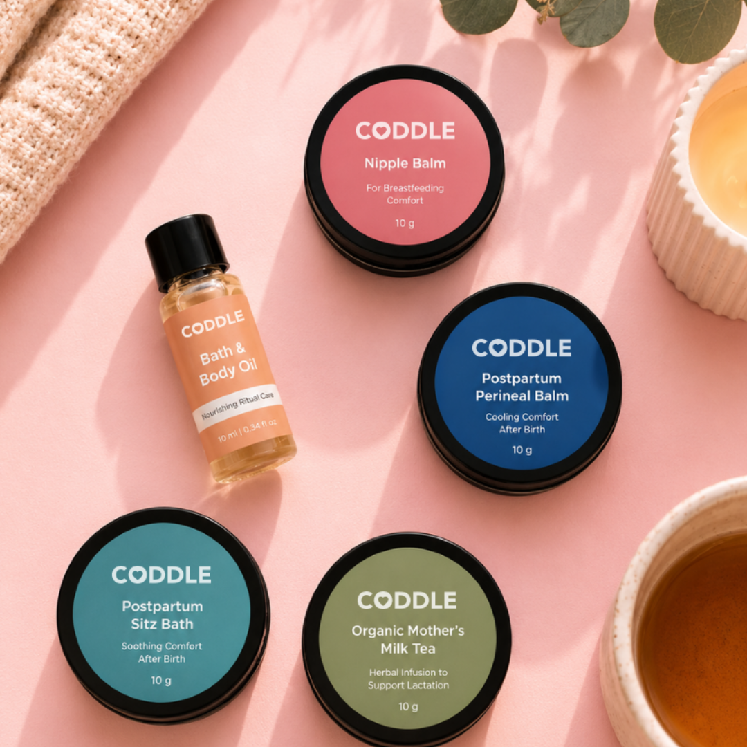 CODDLE Mini Postpartum Recovery Kit packed in a blush cosmetic pouch with postpartum recovery essentials, perfect for a hospital bag, travel, or bedside recovery care.
