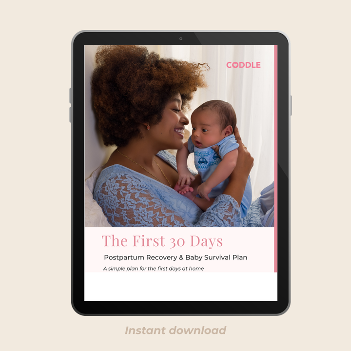 Mom holding a baby during postpartum recovery