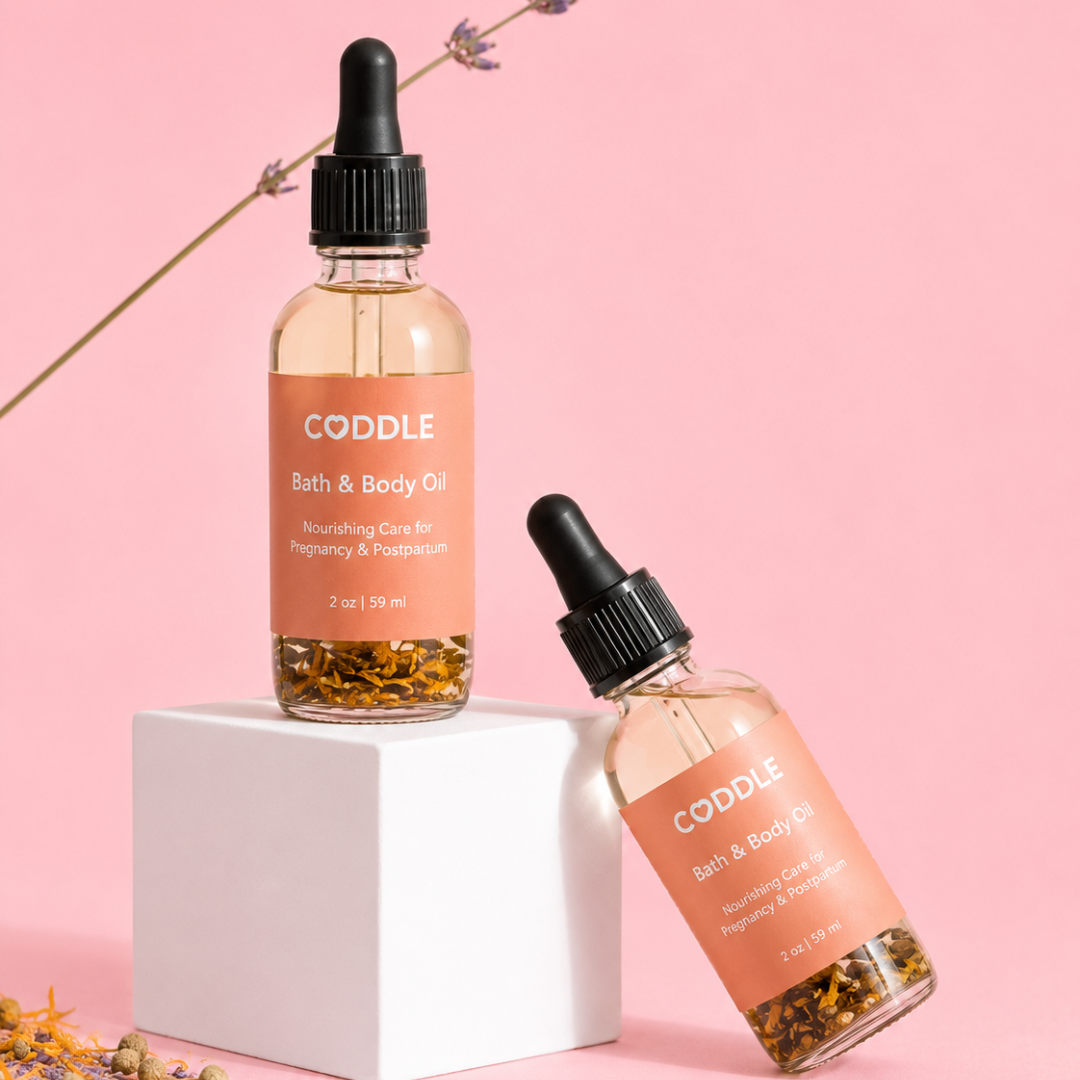 CODDLE Bath & Body Oil with lavender in a premium studio product photo featuring a blush background and white pedestal.