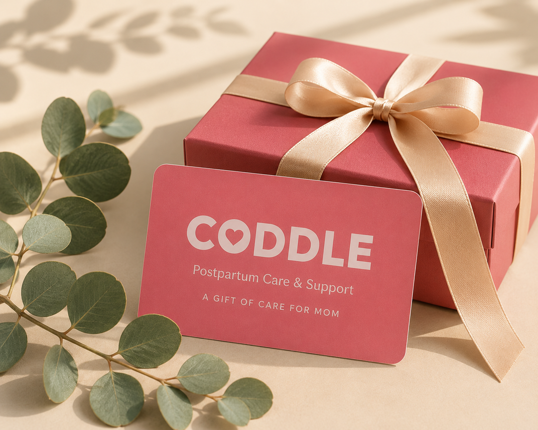CODDLE postpartum care gift card with pink gift box and eucalyptus