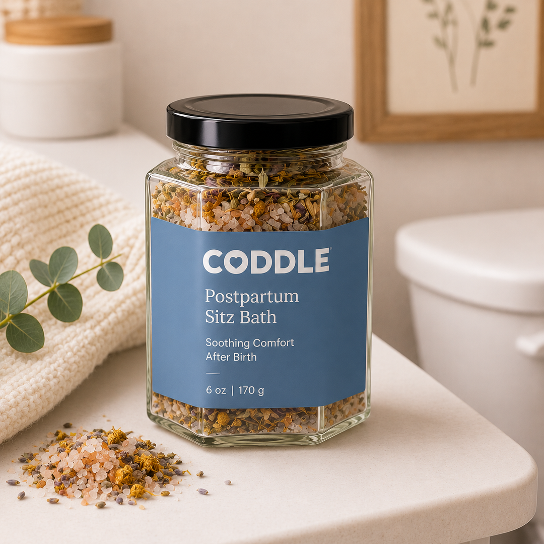 CODDLE Postpartum Sitz Bath recovery soak featuring mineral-rich bath salts and soothing herbs in a hexagon glass jar for gentle postpartum comfort and healing after birth.