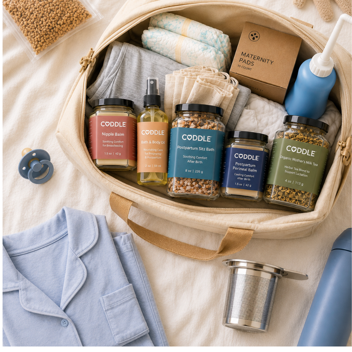 Packing postpartum recovery essentials including peri bottle, herbal sitz bath, massage oil and balms into hospital bag.