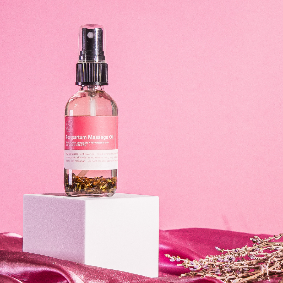 Postpartum massage oil for soothing body care and relaxation after birth.