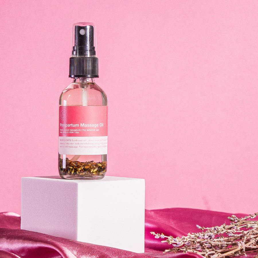 Postpartum massage oil for soothing body care and relaxation after birth.